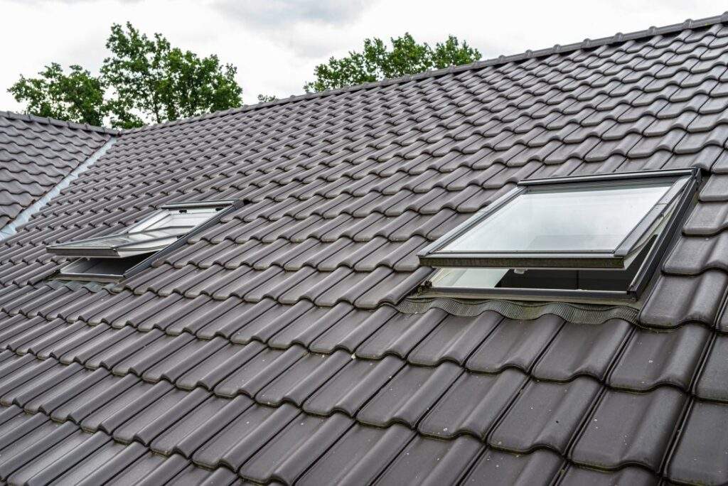 two open roof windows in the attic visible anthracite ceramic tiles 